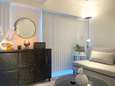 a bedroom with a bed and a mirror and a dresser at Alo BnB 11 - Near Roppongi, Ginza, Shinjuku, Shibuya - Self check-in in Tokyo