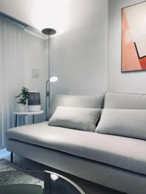 a couch in a living room with a lamp at Alo BnB 11 - Near Roppongi, Ginza, Shinjuku, Shibuya - Self check-in in Tokyo