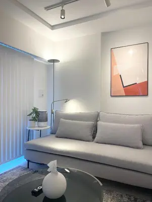 a living room with a couch and a table at Alo BnB 11 - Near Roppongi, Ginza, Shinjuku, Shibuya - Self check-in in Tokyo