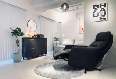 a living room with a black chair and a couch at Alo BnB 11 - Near Roppongi, Ginza, Shinjuku, Shibuya - Self check-in in Tokyo