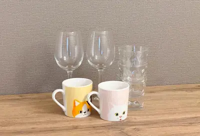 a table with two glasses and two empty wine glasses at Higashi-Ueno 3 in Tokyo