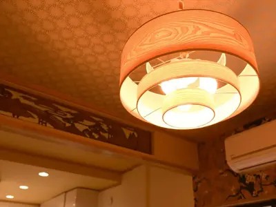 a chandelier hanging from the ceiling of a restaurant at Sumida Tatekawa House in Tokyo