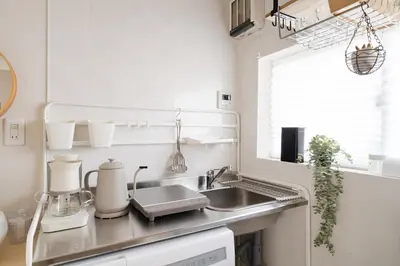 a kitchen counter with a sink and a window at Fuufu House Tokyo SHIBUYA - No Elevator 4F WalkUp in Tokyo