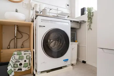 a washer and dryer in a kitchen at Fuufu House Tokyo SHIBUYA - No Elevator 4F WalkUp in Tokyo