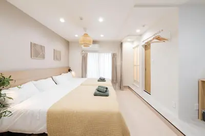 a bedroom with a large bed in a room at Fuufu House Tokyo SHIBUYA - No Elevator 4F WalkUp in Tokyo