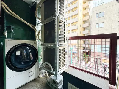 a washing machine in a room with a window at Hotel-Mercurius-ShinOkubo-SBJB3F in Tokyo