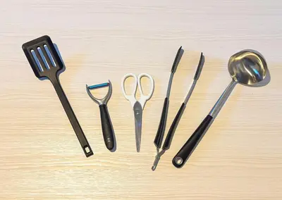 a group of utensils sitting on top of a table at Hotel-Mercurius-ShinOkubo-SBJB3F in Tokyo