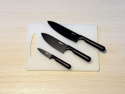 two knives on a cutting board on a table at Hotel-Mercurius-ShinOkubo-SBJB3F in Tokyo