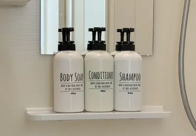 three bottles of soap on a shelf in a bathroom at \u304b\u3064\u3089201 in Tokyo