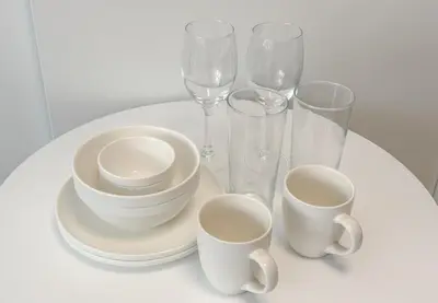 a white table with cups and glasses on it at \u304b\u3064\u3089201 in Tokyo