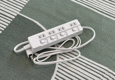 a nintendo wii game controller sitting on the floor at \u304b\u3064\u3089201 in Tokyo