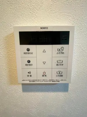 a machine on a wall with different symbols on it at be\u30c6\u30e9\u30b9202 in Tokyo
