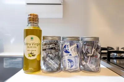 a bottle of oil next to three jars of food at LIVCITY Kinshicho 201 in Tokyo