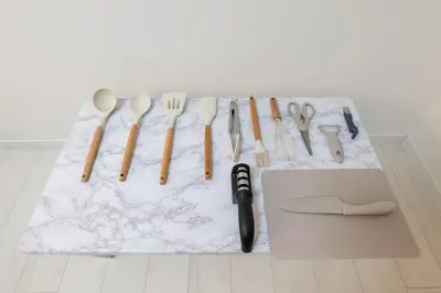 a bunch of utensils sitting on a table with a counter at LIVCITY Kinshicho 201 in Tokyo
