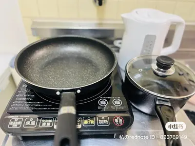 a frying pan sitting on top of a stove at Tokyo Maneki Stay Gotokuji in Tokyo