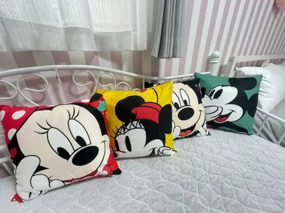 a bed with three mickey pillows on it at Shitamachi Shin-Koiwa 201 in Tokyo