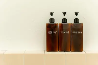 three bottles of soap sitting on top of a counter at \u548c\u6c23\u4f1a\u3005\u5357\u9577\u5d0e Wakiaiai Minaminagasaki in Tokyo
