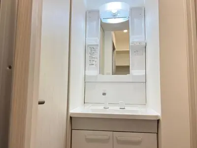 a bathroom with a sink and a mirror at Ikebukuro Area 1F01 NishiikeApartment in Tokyo