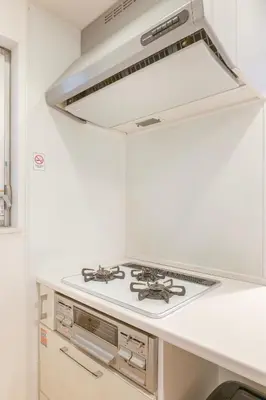 a white stove top oven in a kitchen at NEW OPEN! 3bedroom house in Ikebukuro with a carp \u3048\u3060\u307e\u3081\u30a4\u30f3 in Tokyo