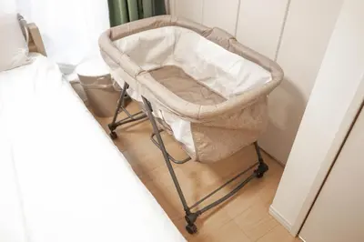 a baby carriage in a bedroom next to a bed at NEW OPEN! 3bedroom house in Ikebukuro with a carp \u3048\u3060\u307e\u3081\u30a4\u30f3 in Tokyo