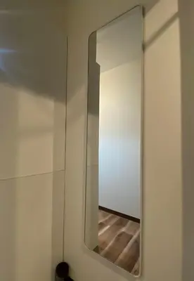 a mirror on a wall in a room at daren stay in Tokyo