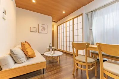 a living room with a couch and a table at Waseda 2Bedroom Apt 1 Min to Station, Direct to Ikebukuro, Near Shinjuku in Tokyo