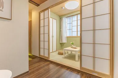 a room with a large mirror and a table at Waseda 2Bedroom Apt 1 Min to Station, Direct to Ikebukuro, Near Shinjuku in Tokyo