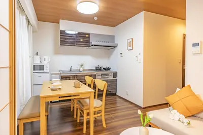 a kitchen and a dining room with a table and chairs at Waseda 2Bedroom Apt 1 Min to Station, Direct to Ikebukuro, Near Shinjuku in Tokyo