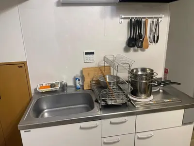 a kitchen sink with pots and pans on a counter at ichigo ichie 8minute walk HigashiMukojima Tokyo sightseeing in Tokyo