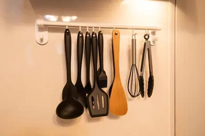 a bunch of kitchen utensils hanging on a rack at ichigo ichie 8minute walk HigashiMukojima Tokyo sightseeing in Tokyo