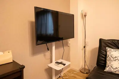 a flat screen tv hanging on a wall at ichigo ichie 8minute walk HigashiMukojima Tokyo sightseeing in Tokyo