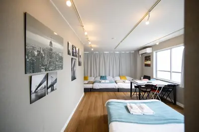 a room with a bed and a table in it at Maison Nagasaki V201 - Vacation STAY 16757 in Tokyo