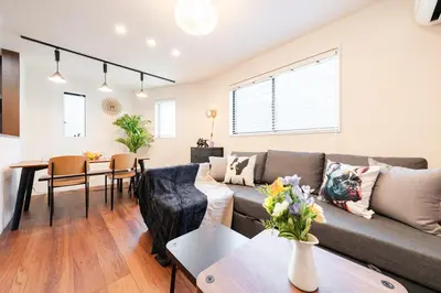 a living room with a couch and a table at tai\u5357\u5143\u753a25 in Tokyo