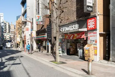 an empty city street with shops and buildings at Azabu artemis in Tokyo