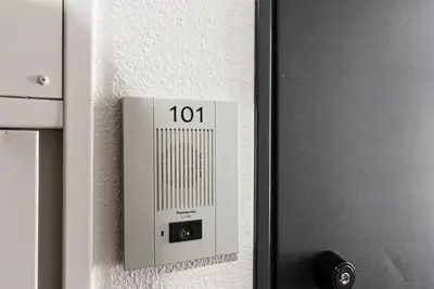 a metal box on the side of a door at NDZ101 3 min walk to station, 2 lines, Yamanote Line, high-speed Wi-Fi in Tokyo
