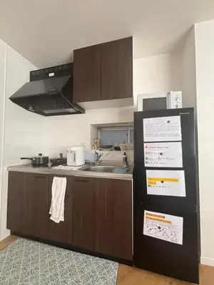 a kitchen with a sink and a counter top at \u6587\u4eachouse 201\u5ba4 in Tokyo
