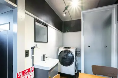 a bathroom with a washing machine and a sink at AkebonoHouse103 in Tokyo