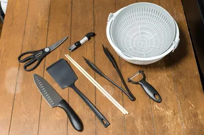 a bunch of kitchen utensils sitting on a wooden table at AkebonoHouse103 in Tokyo
