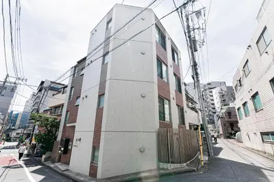 a building on the side of a street at NDZ103 3 min walk to station, 2 lines, Yamanote Line, high-speed Wi-Fi in Tokyo