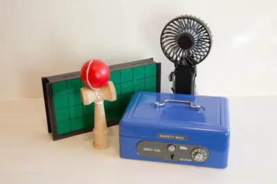 a toy humidifier and a fan next to a box at TOMALCO INN NAKANO 1 4F Flat 2 Bath 13min to Shinjuku from Honancho in Tokyo