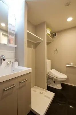 a bathroom with a white toilet and a sink at TOMALCO INN NAKANO 1 4F Flat 2 Bath 13min to Shinjuku from Honancho in Tokyo