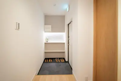 a room with a hallway with a row of shoes at Humming Kinshicho 303-202-301 - Vacation STAY 19264 in Tokyo