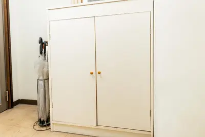 a white cabinet with two doors in a room at Humming Kinshicho 303-202-301 - Vacation STAY 19264 in Tokyo