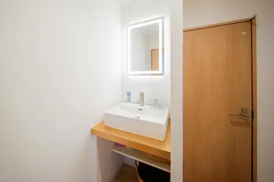 a bathroom with a white sink and a mirror at Humming Kinshicho 303-202-301 - Vacation STAY 19264 in Tokyo