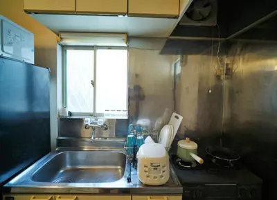 a small kitchen with a sink and a window at Heights Omiya - Vacation STAY 15175 in Tokyo