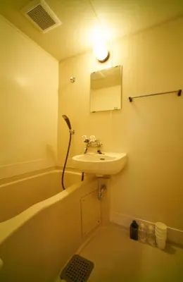 a bathroom with a sink and a bath tub at Heights Omiya - Vacation STAY 15175 in Tokyo
