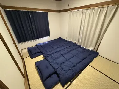 a blue bed in a room with a window at Heights Omiya - Vacation STAY 19467 in Tokyo