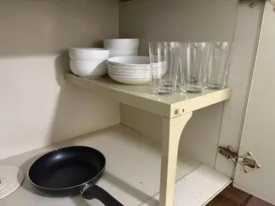 a shelf with bowls and plates and glasses on it at Heights Omiya - Vacation STAY 19467 in Tokyo