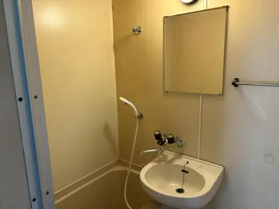 a bathroom with a sink and a mirror at Heights Omiya - Vacation STAY 19467 in Tokyo