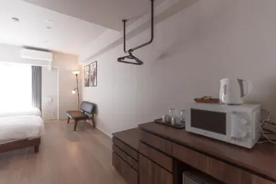 a room with a bed and a tv on a counter at LANG HOTEL Kameido - Vacation STAY 79534v in Tokyo
